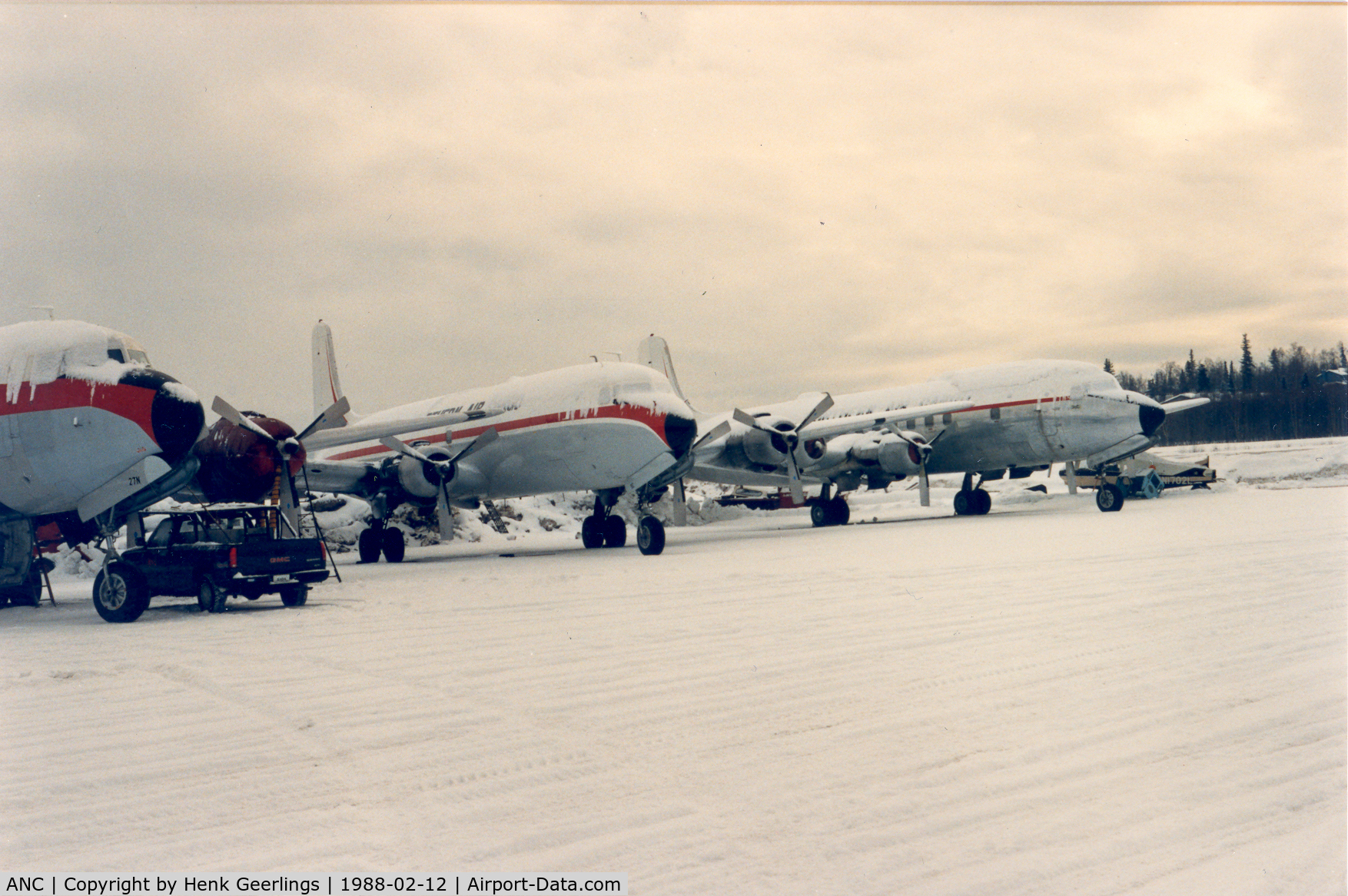 Ted Stevens Anchorage International Airport (ANC) -  Northern Air Cargo tarmac at Anchorage.

DC-6 fleet on a icy apron , winter 1988