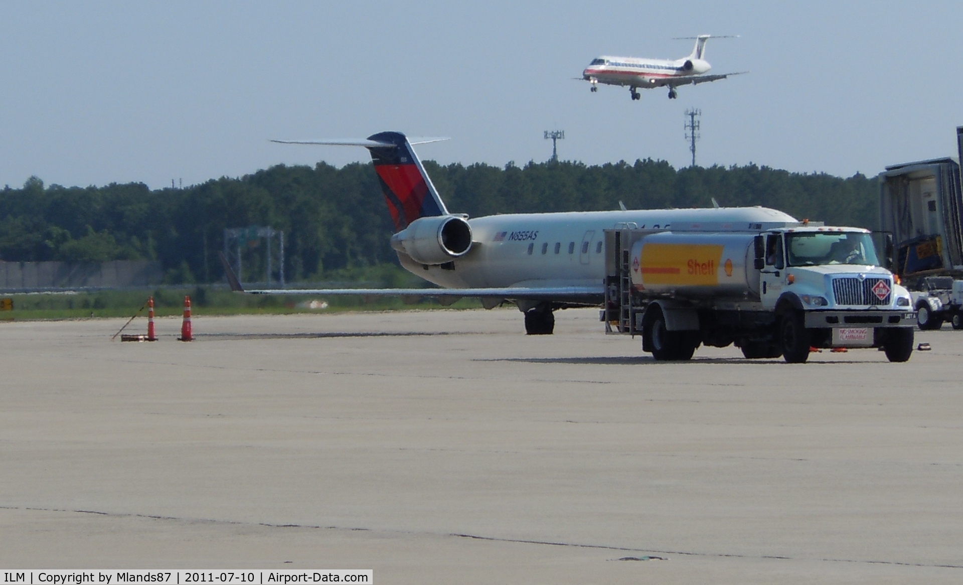 Wilmington International Airport (ILM) - Embraer 135 Landing, CL 600 at the gate.
