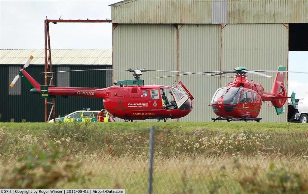 Swansea Airport, Swansea, Wales United Kingdom (EGFH) - Two Wales Air Ambulance helicopters at the air ambulance base.