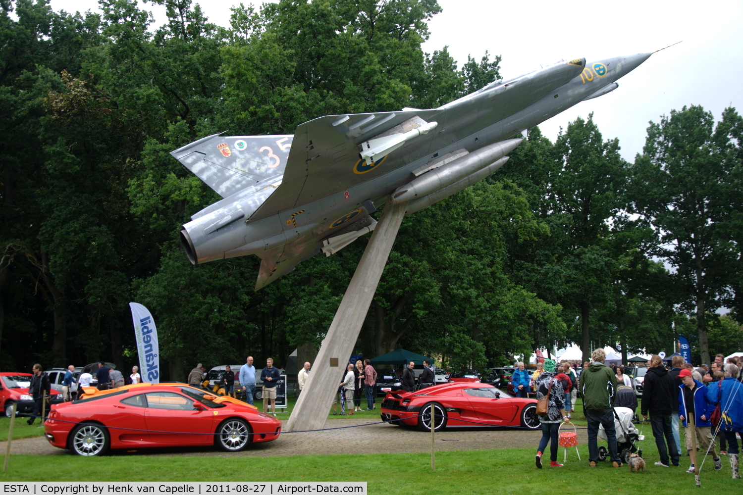 Ängelholm-Helsingborg Airport, Ängelholm / Helsingborg Sweden (ESTA) - This Saab j35J Draken is positioned on a pole in the Valhall Park of the airfield. The sportscars were parked below it for the Lergökarraly 2011.