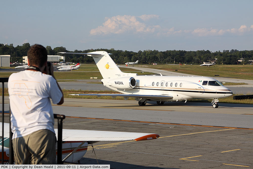 Dekalb-peachtree Airport (PDK) - From the spotting location at PDK, a person photographs a nice Hawker 4000, N40VK as it taxis by for departure.