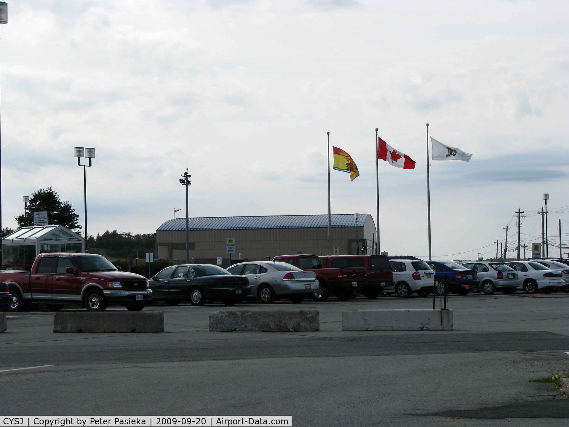 Saint John Airport, Saint John, New Brunswick Canada (CYSJ) - Flags flying near the main parking lot at the Saint John Airport