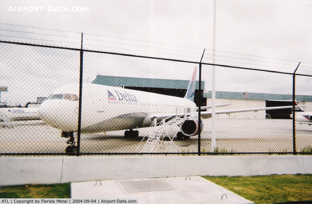 Hartsfield - Jackson Atlanta International Airport (ATL) - Delta maintenance scanned from an old film shot.  Hurricane Frances was approaching the ATL