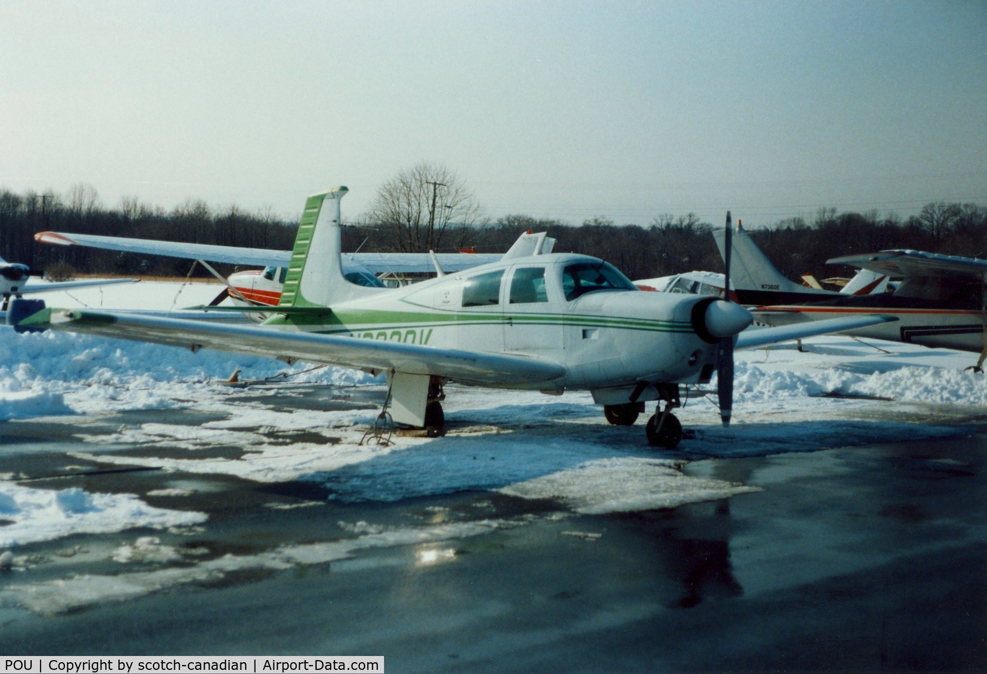 Dutchess County Airport (POU) - Mooney Aircraft parked at Dutchess County Airport, Poughkeepsie, NY - circa 1980's