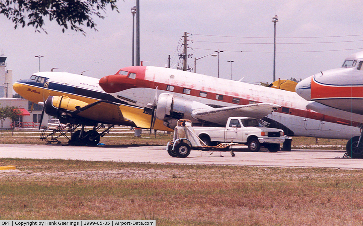 Opa-locka Executive Airport (OPF) - Yellow plane is N50E , cn 11657  DC-3A

Red plane is  N212DD , cn 43389  C-117D

Nose  N381AA , DC-7BF  cn 44921