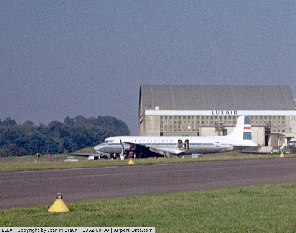 Luxembourg International Airport, Luxembourg Luxembourg (ELLX) - Poor quality photo as scanned & processed from old dia. Loftleidir's DC- 6B, ex PAN AM clipper parked near hangar. Registration is probably TF-LLB. 1962 is a close guess  