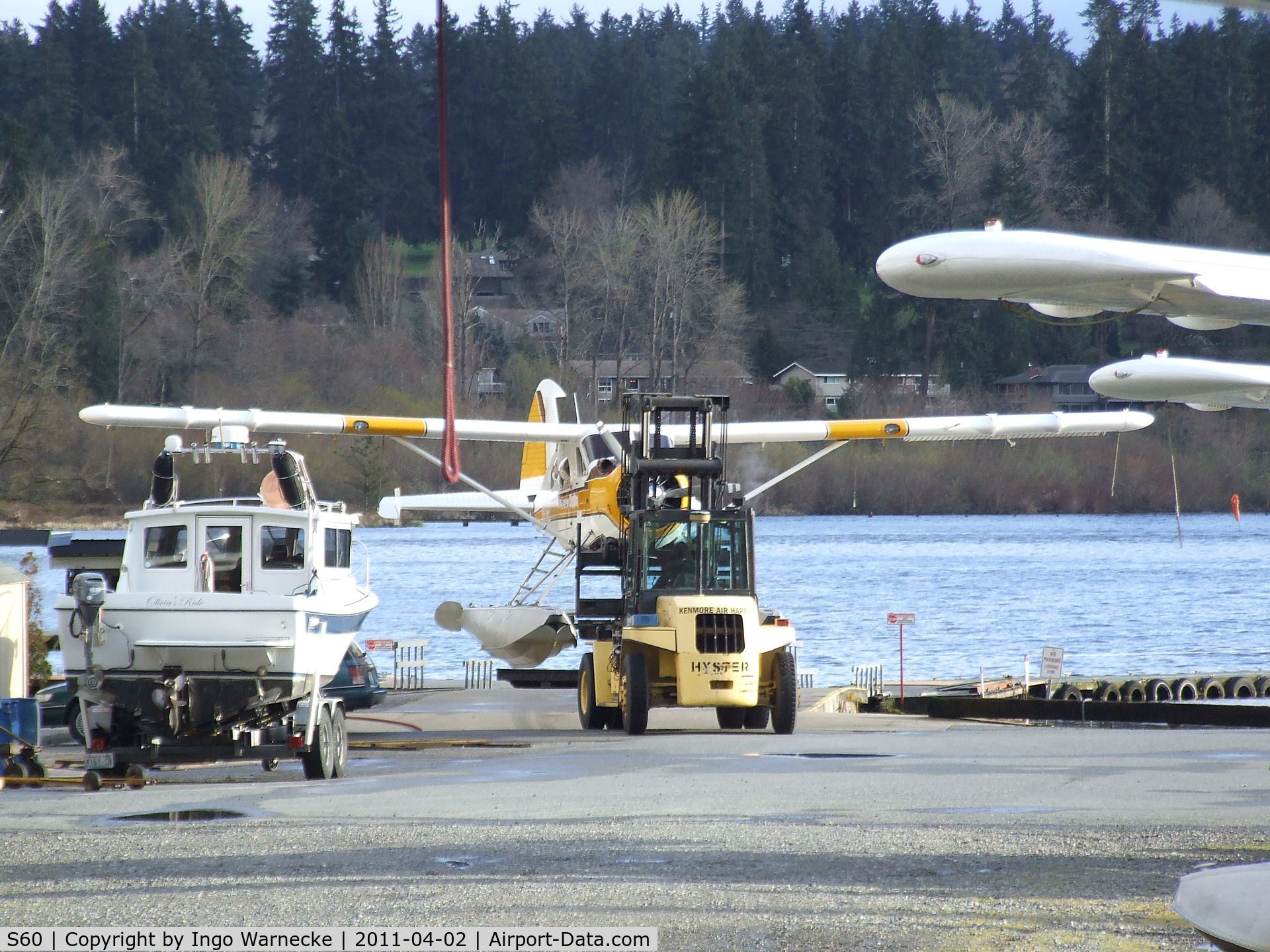 Kenmore Air Harbor Inc Seaplane Base (S60) - a Beaver is being beached and 