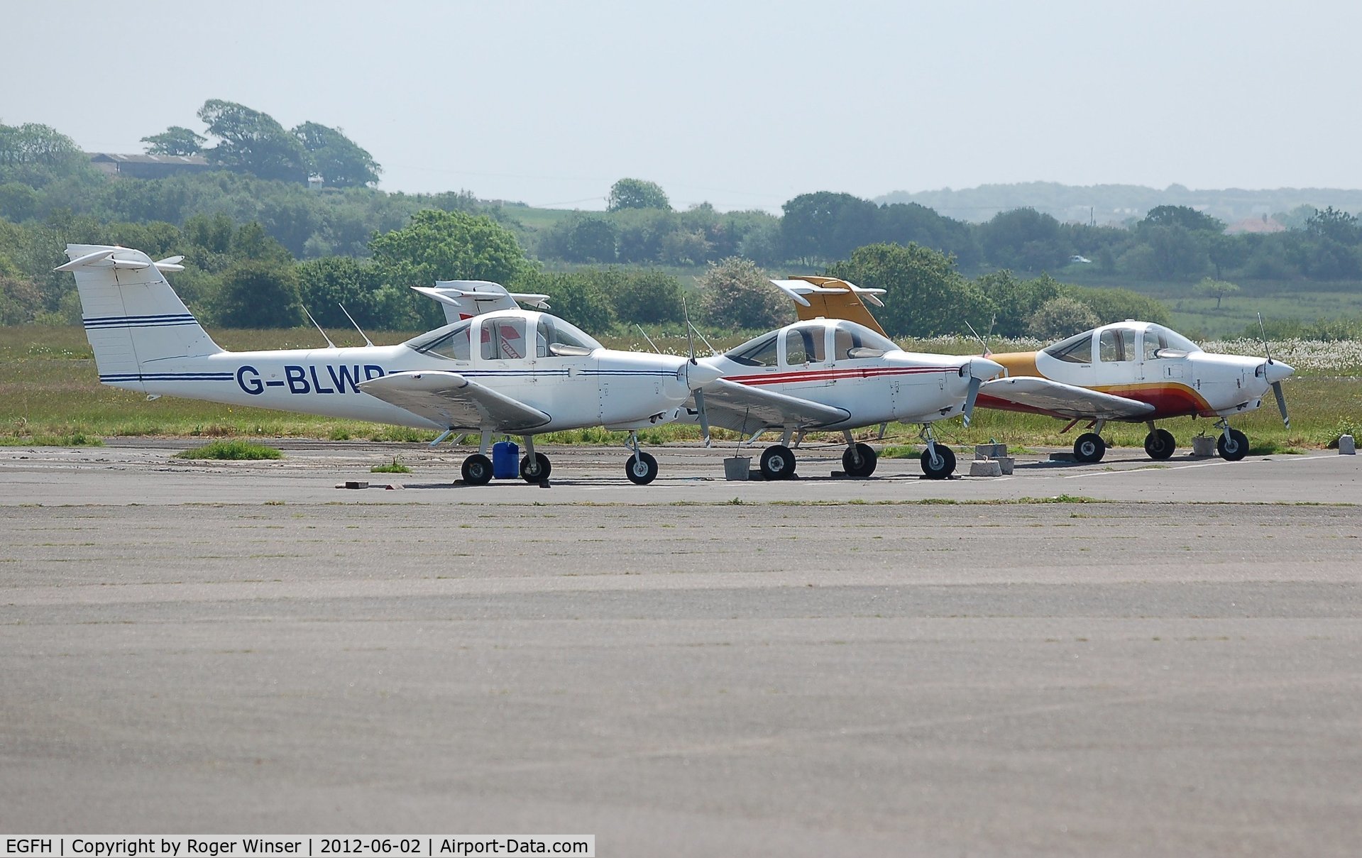 Swansea Airport, Swansea, Wales United Kingdom (EGFH) - Three of Cambrian Flying Club's Piper Tomahawk aircraft.