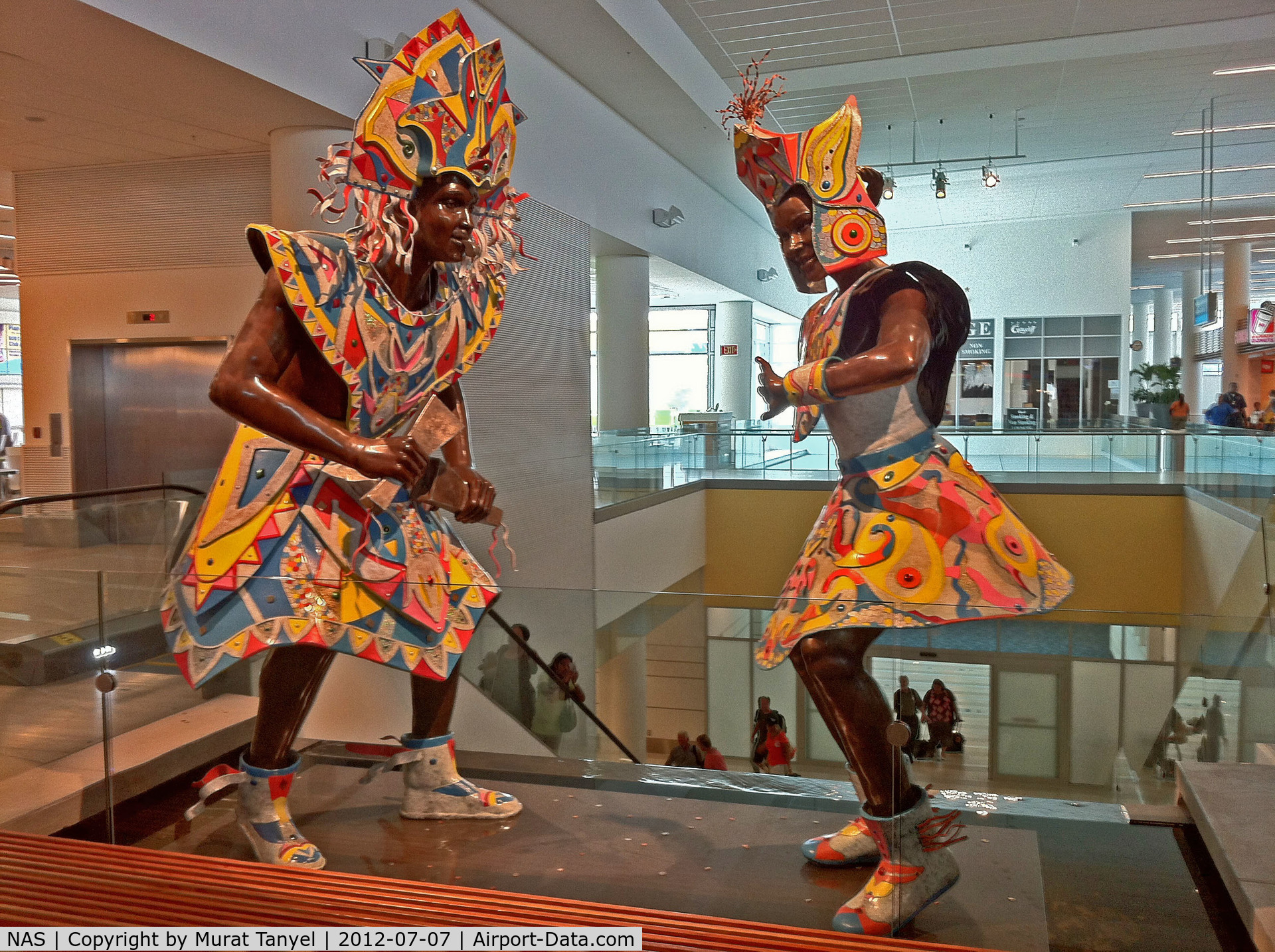 Lynden Pindling International Airport (Nassau Intl), Nassau, New Providence Bahamas (NAS) - The statues at the top of the US departures escalator