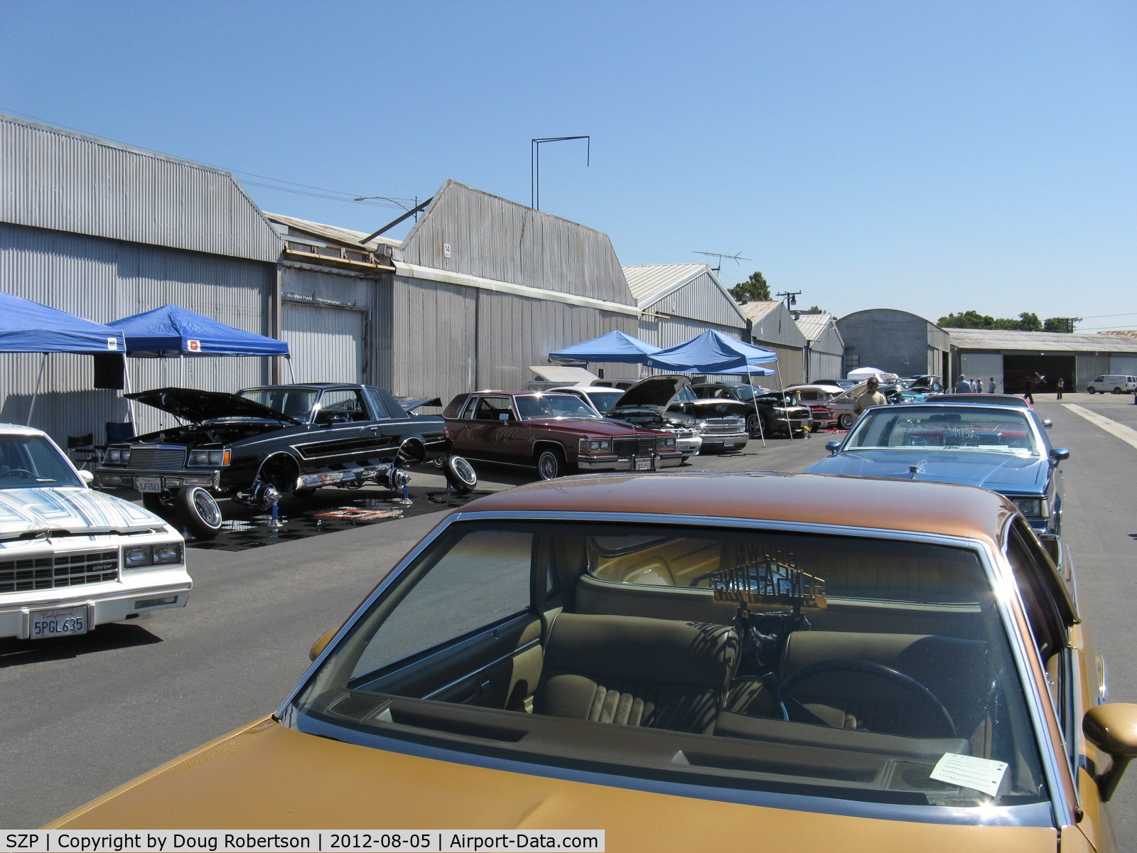 Santa Paula Airport (SZP) - First Sunday Aviation Museum of Santa Paula Open House & Fly-In invites car clubs-another hydraulically jacked up custom car showing suspension, hydraulics and custom wheels. 