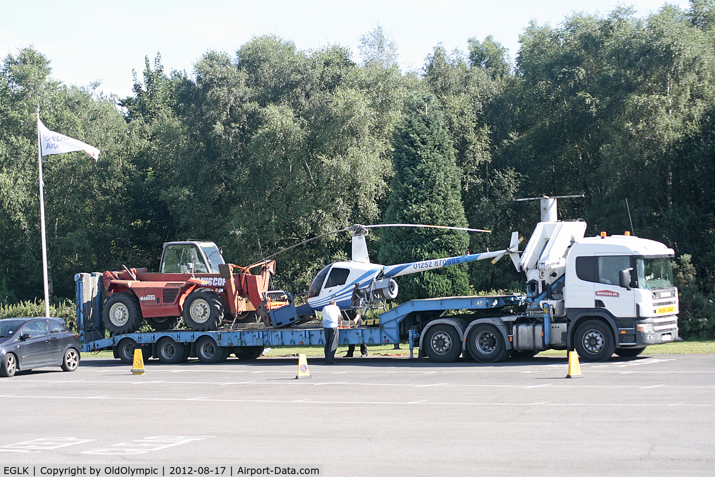 Blackbushe Airport, Camberley, England United Kingdom (EGLK) - Removal of R22 display exhibit from airport entrance