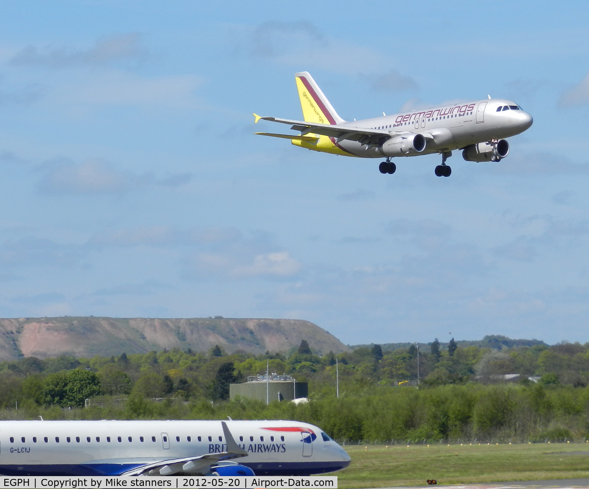 Edinburgh Airport, Edinburgh, Scotland United Kingdom (EGPH) - Germanwings A319-132 D-AGWM comes in to Land from CGN While EMB190-100SR G-LCYJ Waits to enter runway 06 for departure to LCY