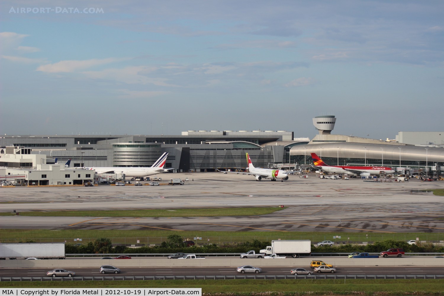 Miami International Airport (MIA) - TAP Air Portugal pulling out of the gate between Air France and Avianca