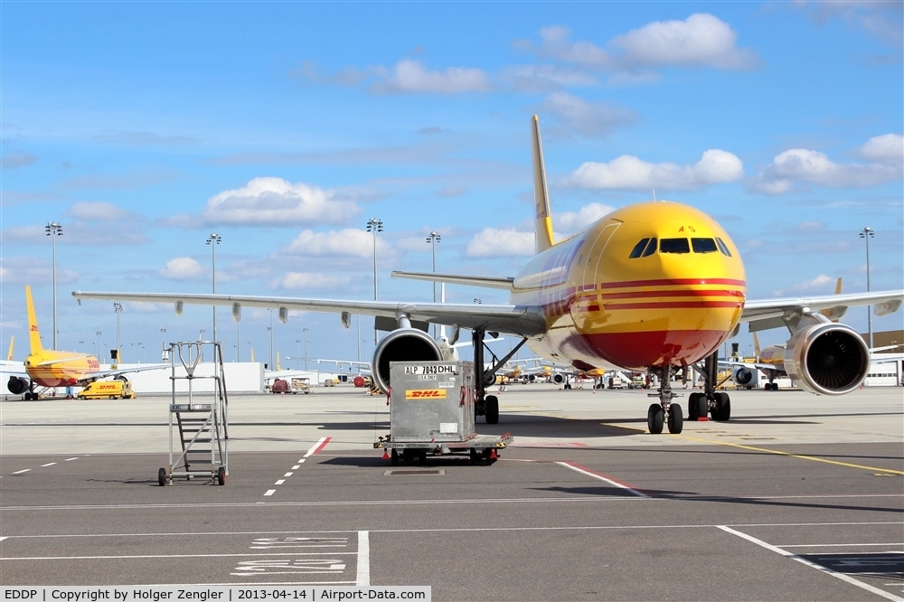 Leipzig/Halle Airport, Leipzig/Halle Germany (EDDP) - View thru the fence on apron 4 (but don´t finger me to DHL!)...