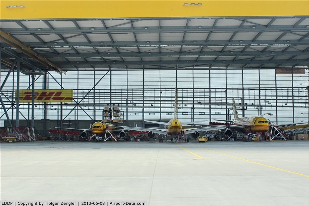 Leipzig/Halle Airport, Leipzig/Halle Germany (EDDP) - No.1000 of my airport pics is dedicated to DHL which always offers a good scene to me (currently a view into a well filled hangar)....