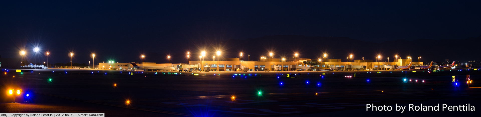Albuquerque International Sunport Airport (ABQ) - Albuquerque's International Terminal (Sunport) at night from the runway side.