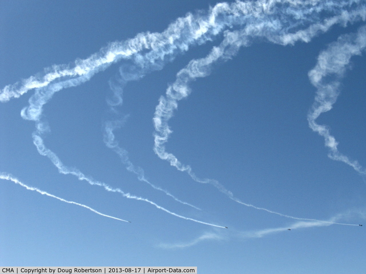 Camarillo Airport (CMA) - Warbirds in turning echelon flight with smoke