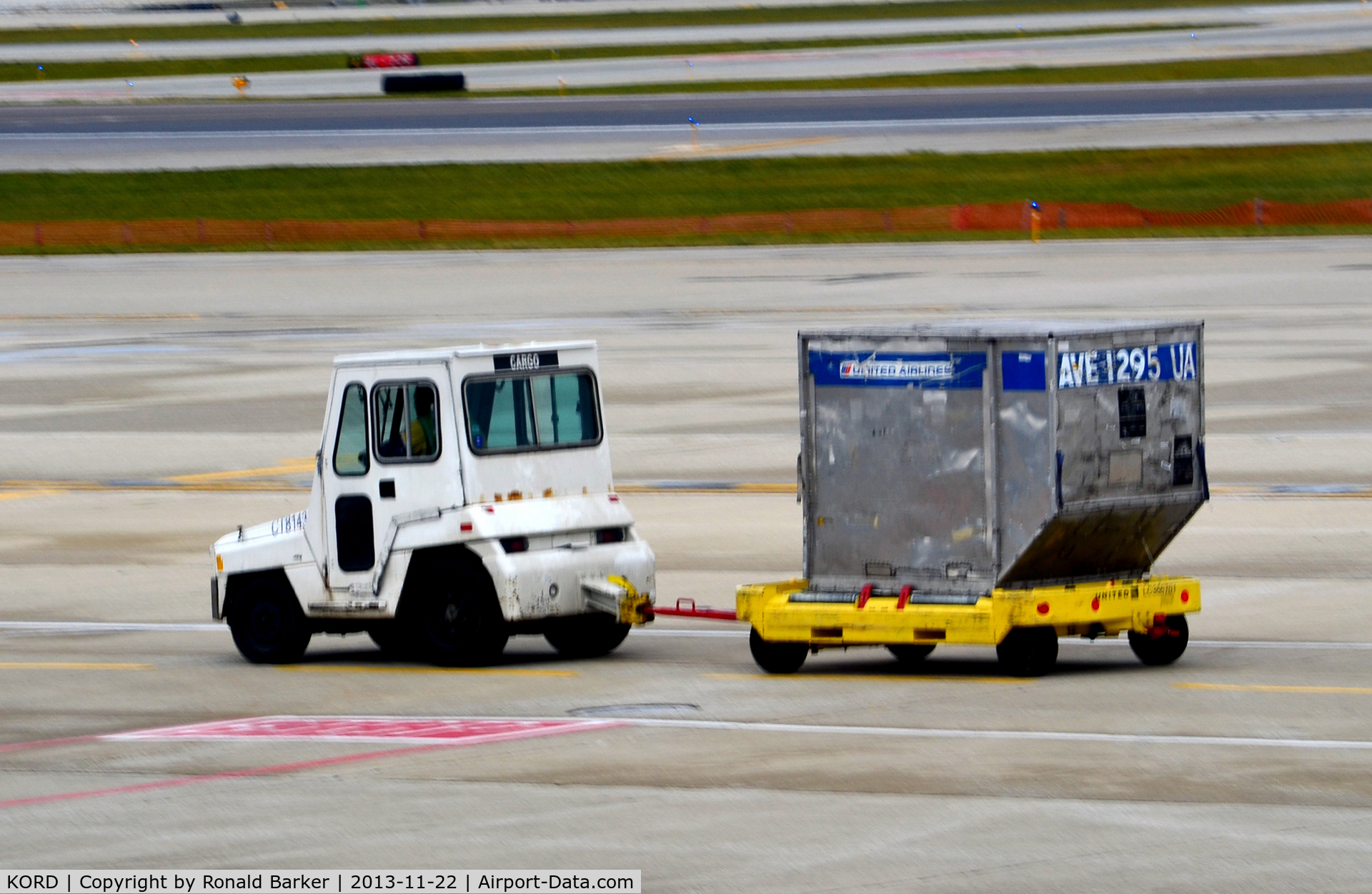 Chicago O'hare International Airport (ORD) - Tug pulling cargo container O'Hare