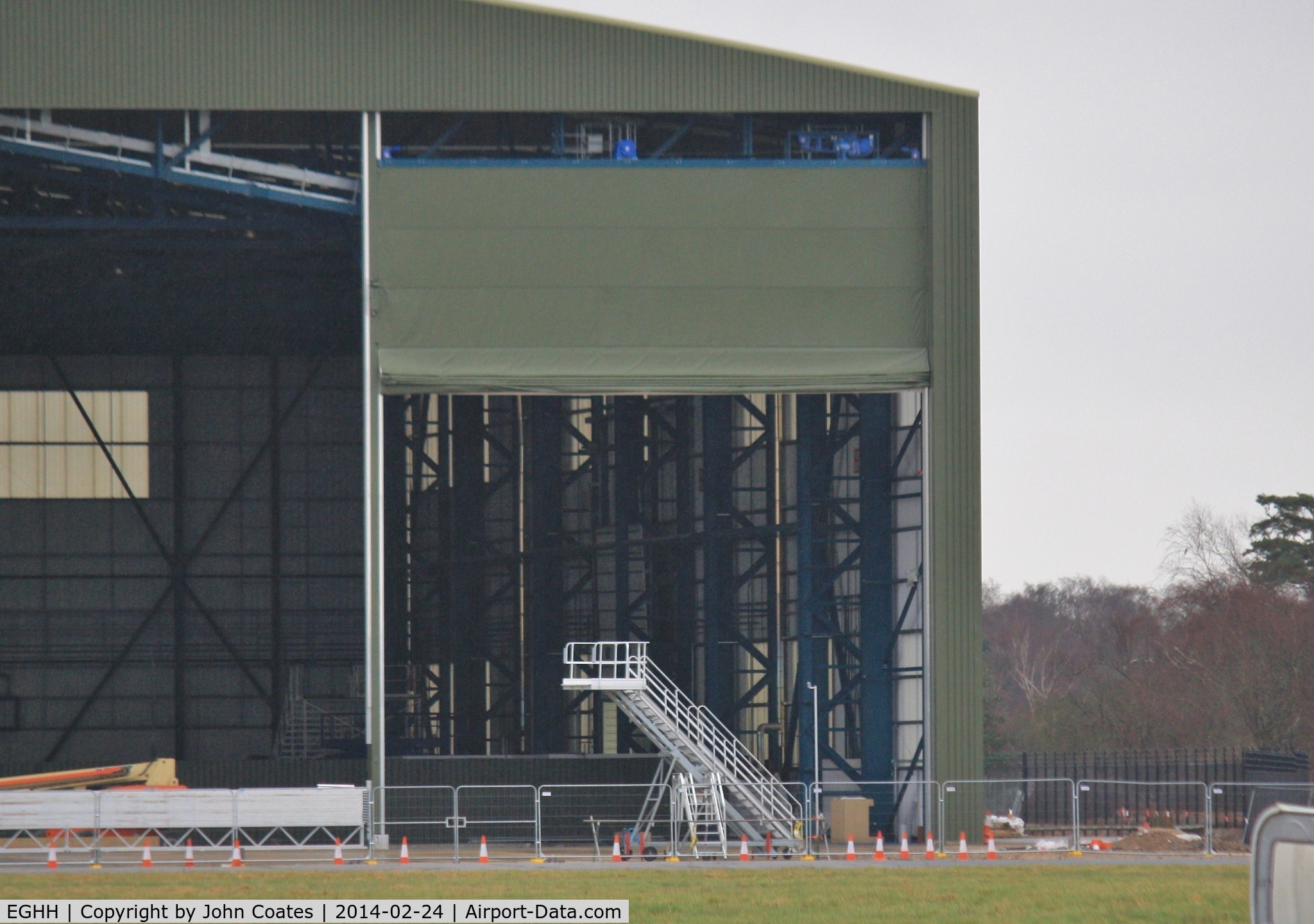 Bournemouth Airport, Bournemouth, England United Kingdom (EGHH) - Interesting door type on new hangar extensions.