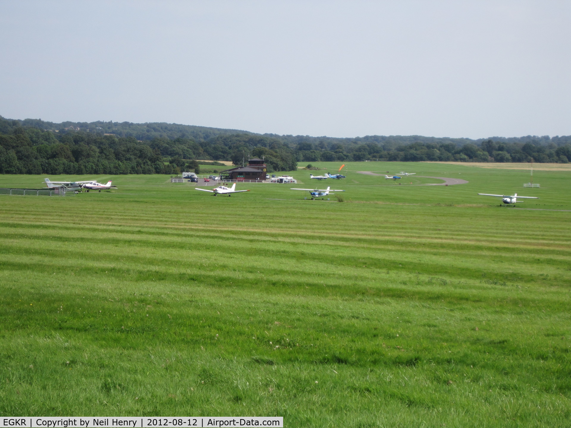 Redhill Aerodrome Airport, Redhill, England United Kingdom (EGKR) - Photo taken 12 August 2012 from adjacent field being used as car parking for Redhill Steam Rally