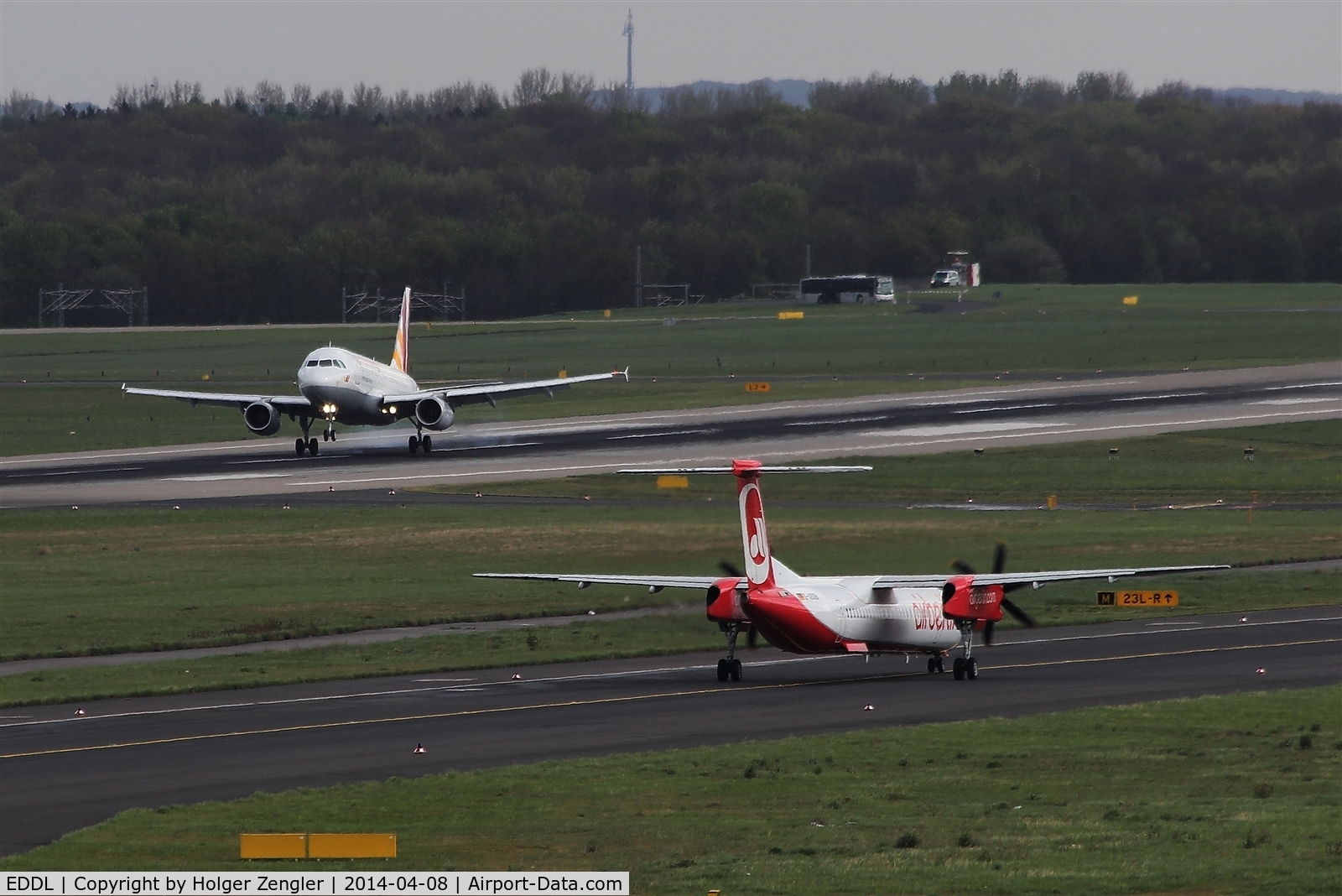 Düsseldorf International Airport, Düsseldorf Germany (EDDL) - One is going the other is preparing to follow on rwy 23R...
