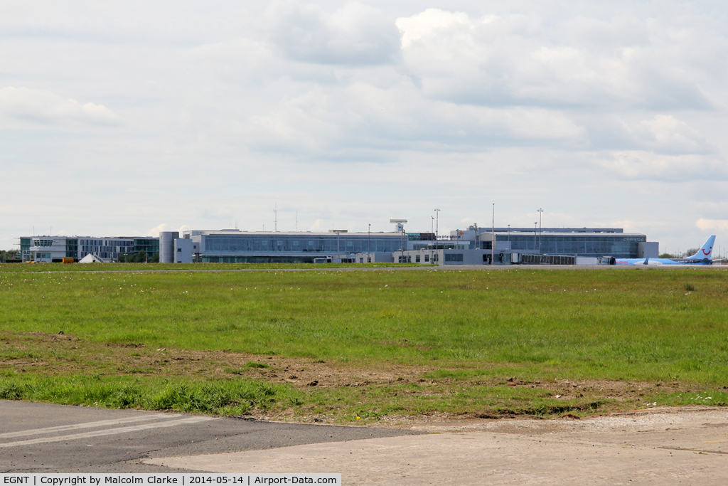 Newcastle Airport, Newcastle upon Tyne, England United Kingdom (EGNT) - Newcastle airport's terminal buildings viewed from the south side of the runway. May 14 2014.