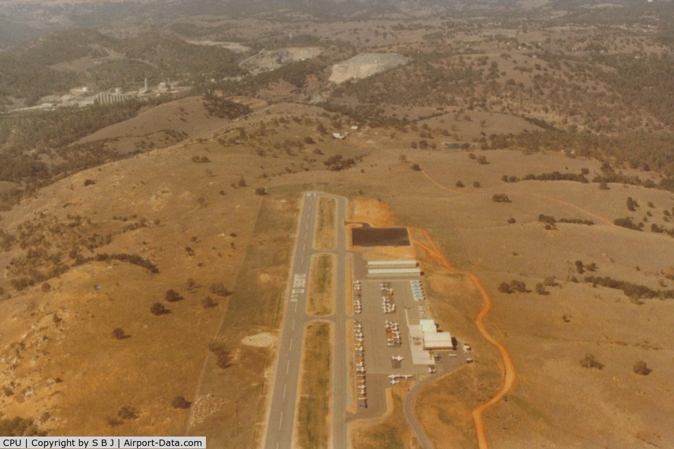 Calaveras Co-maury Rasmussen Field Airport (CPU) - Nice airport and it replaced the old airport (in the mid 80s) that was a short walk to downtown San Andreas which was nice. O well-I guess they call this progress ? View is north with old cement plant (long closed) top left and town of S A top right.