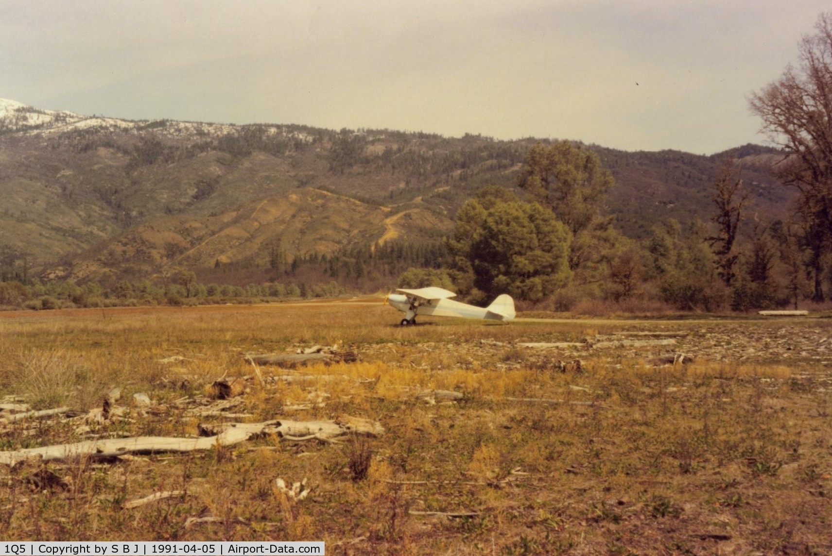 Gravelly Valley Airport (1Q5) - N39932 at Lake Pillsbury in 1991. View is to the north and down the runway. Most pilots take off in the opposite direction toward the lake to avoid the higher terrain. Notice driftwood near 932 which is from high water.