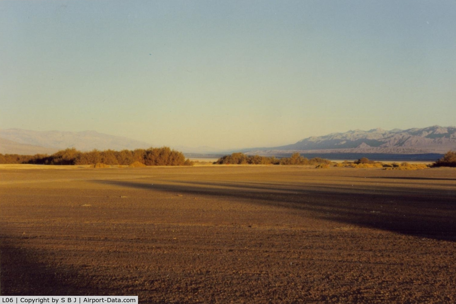 Furnace Creek Airport (L06) - View from the tiedown area toward the  runway and to the NW. Visibility is often unlimited.Frist time flying into D V,pilots will be amused to see the altimeter go below zero by some 200 feet and a 600 ft pattern (altimeter) is in order.