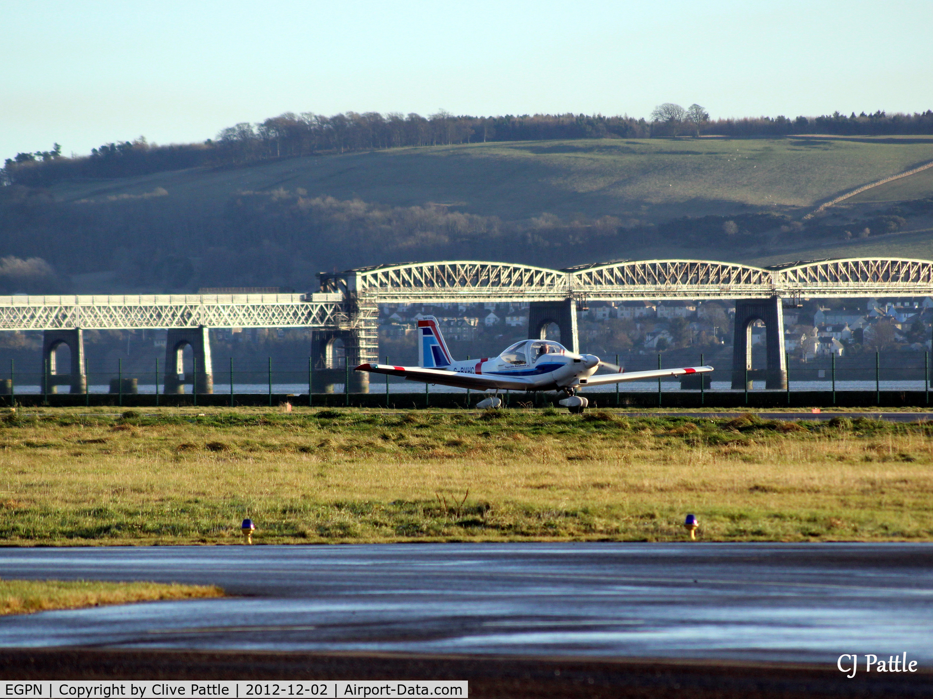 Dundee Airport, Dundee, Scotland United Kingdom (EGPN) - With a backdrop of the Tay Rail Bridge, a Grob Heron of the based Tayside Aviation prepares to take off.