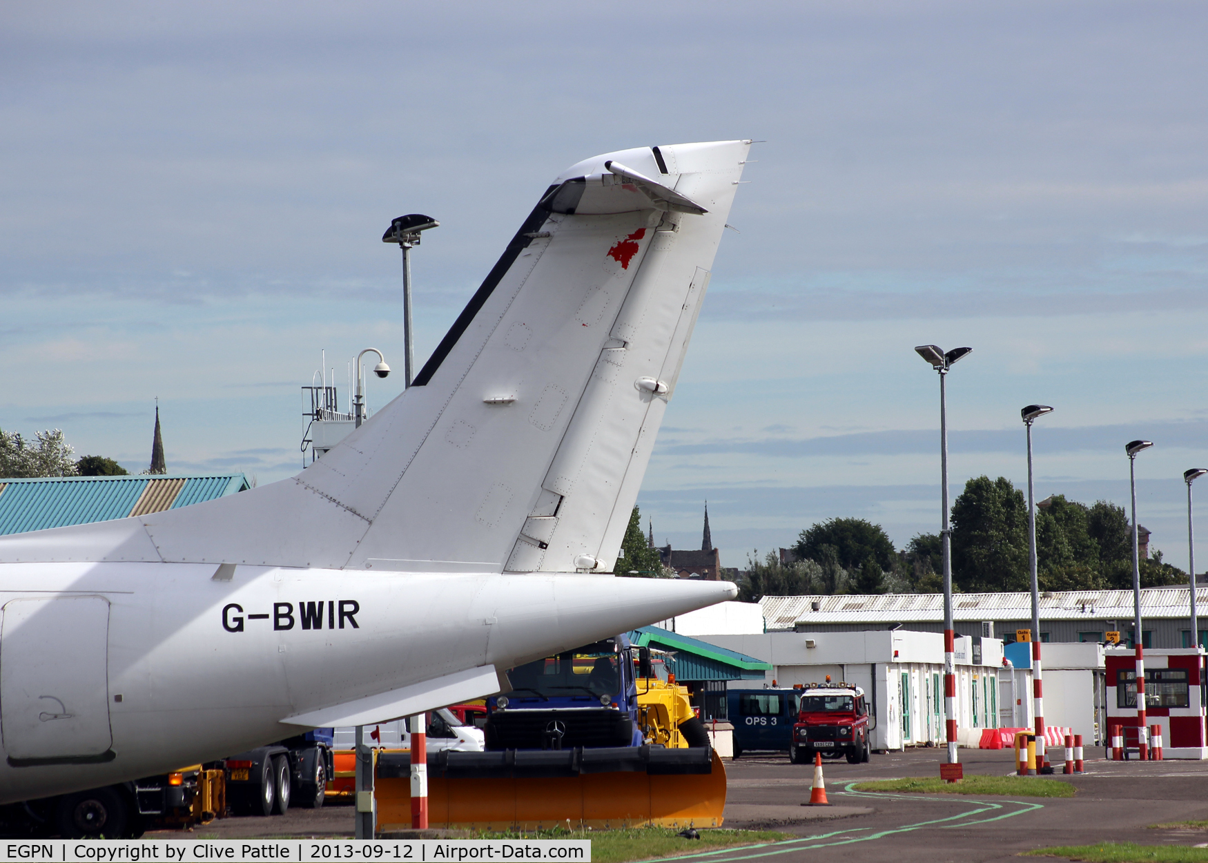 Dundee Airport, Dundee, Scotland United Kingdom (EGPN) - A view of the maintenance area at Dundee Riverside, with the tail of a Dornier 328 parked at the Loganair/Flybe engineering facility at the airport.