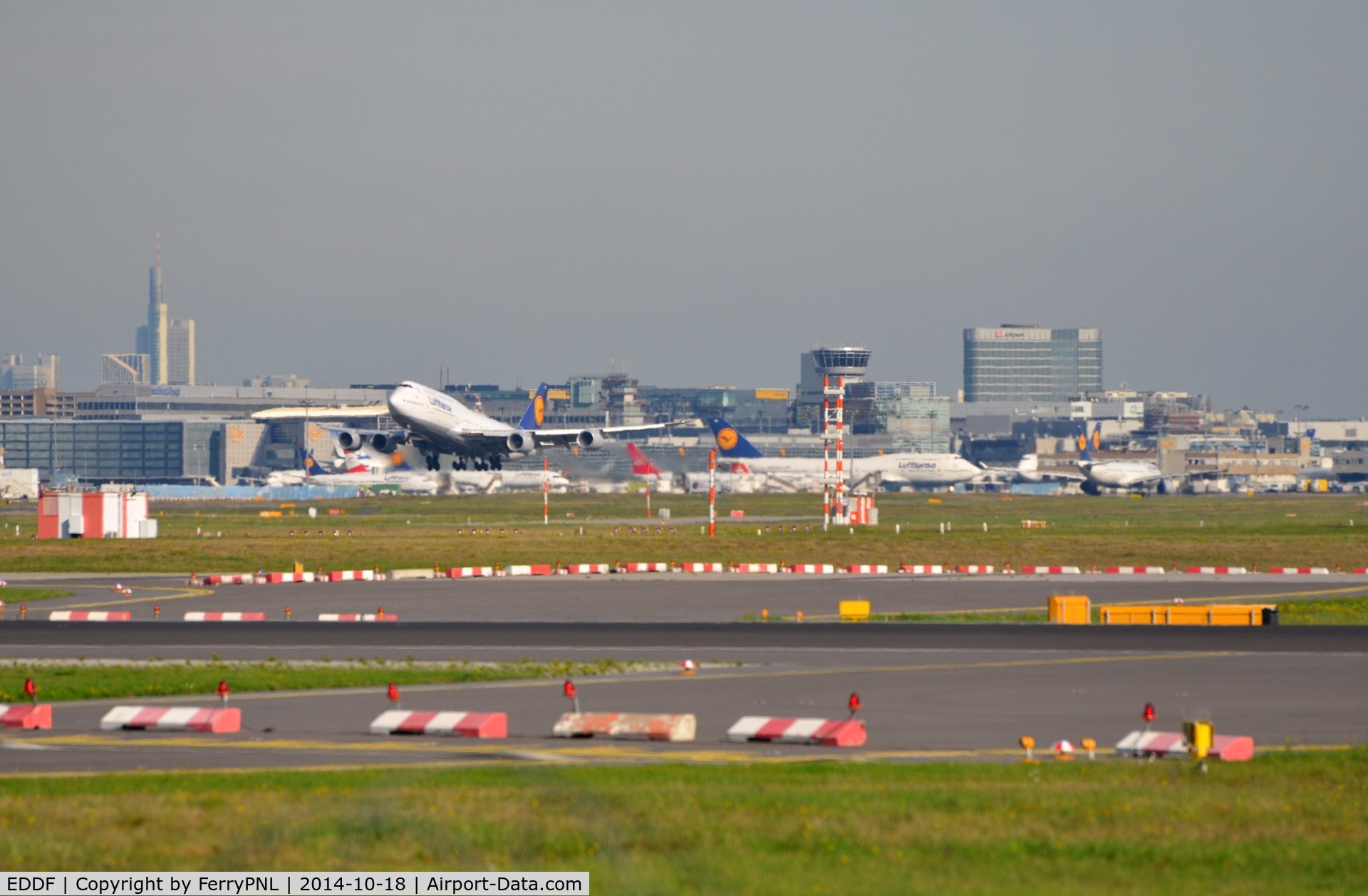 Frankfurt International Airport, Frankfurt am Main Germany (EDDF) - FRA, overlooking 3 runways with the terminal in the distance and the Frankfurt skyline behind it.