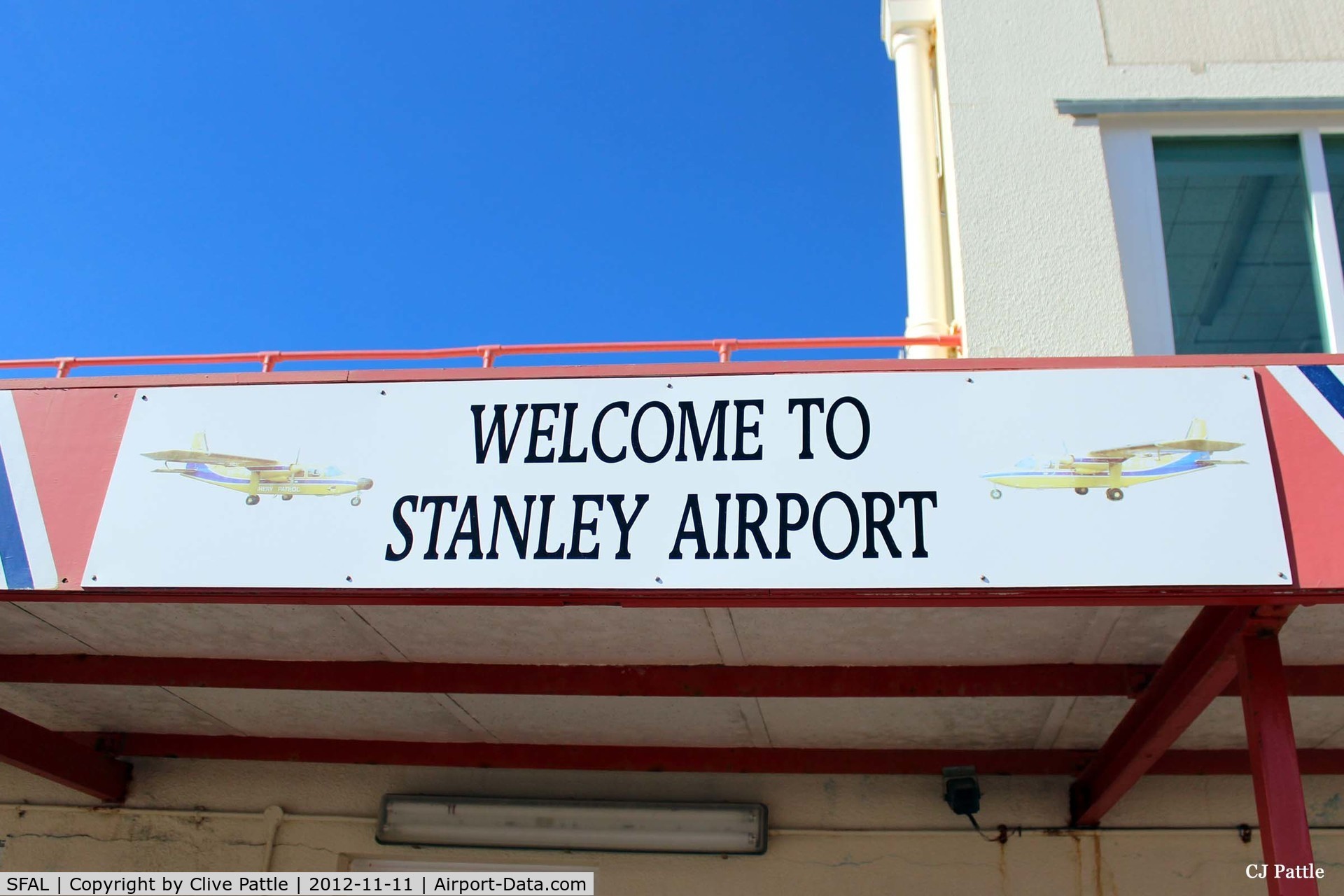 SFAL Airport - Welcome to Stanley Airport sign on the airport terminal building