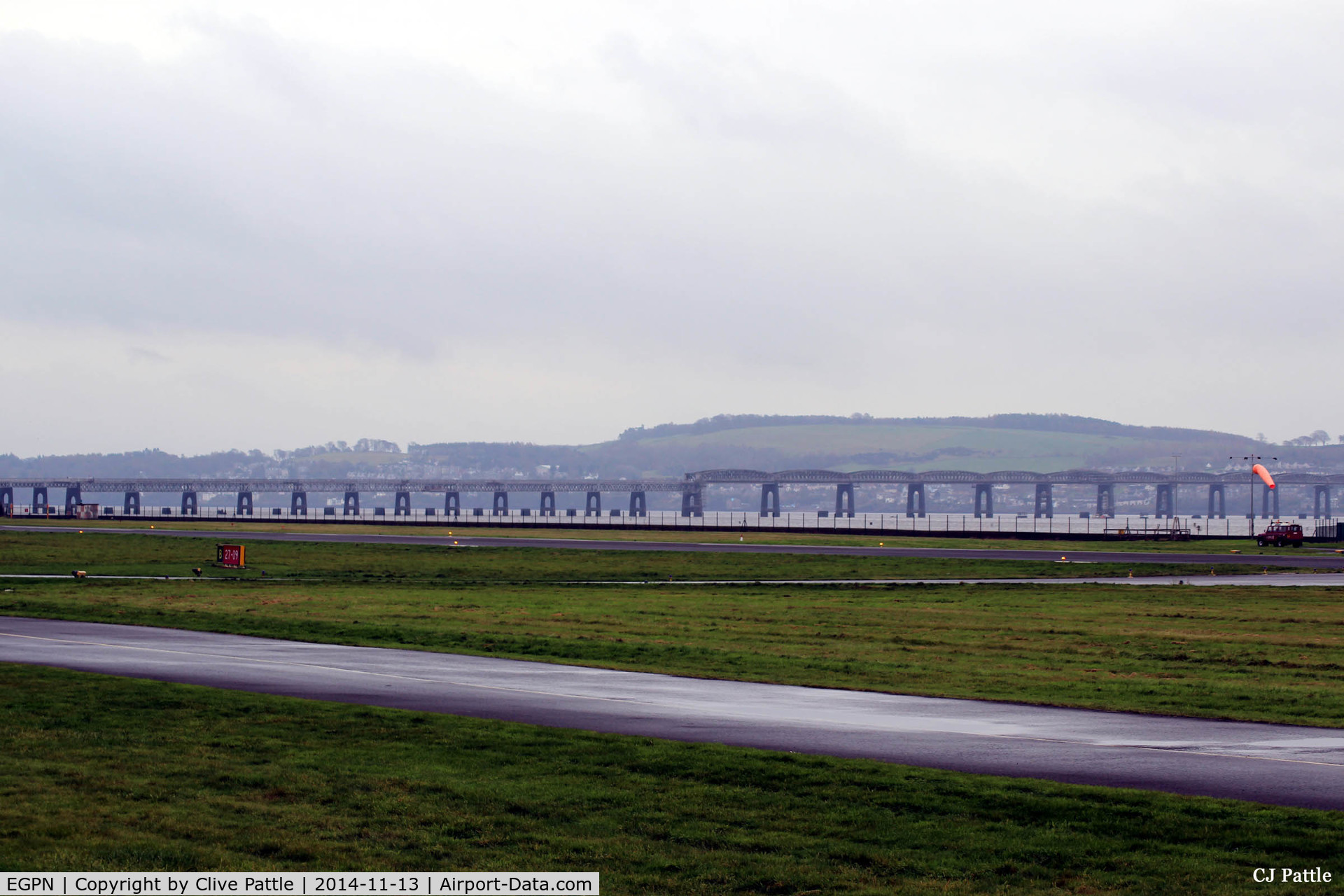 Dundee Airport, Dundee, Scotland United Kingdom (EGPN) - Uncluttered view looking south east across the airfield at Dundee Riverside, towards the Tay Rail Bridge and the Kingdom of Fife beyond.
