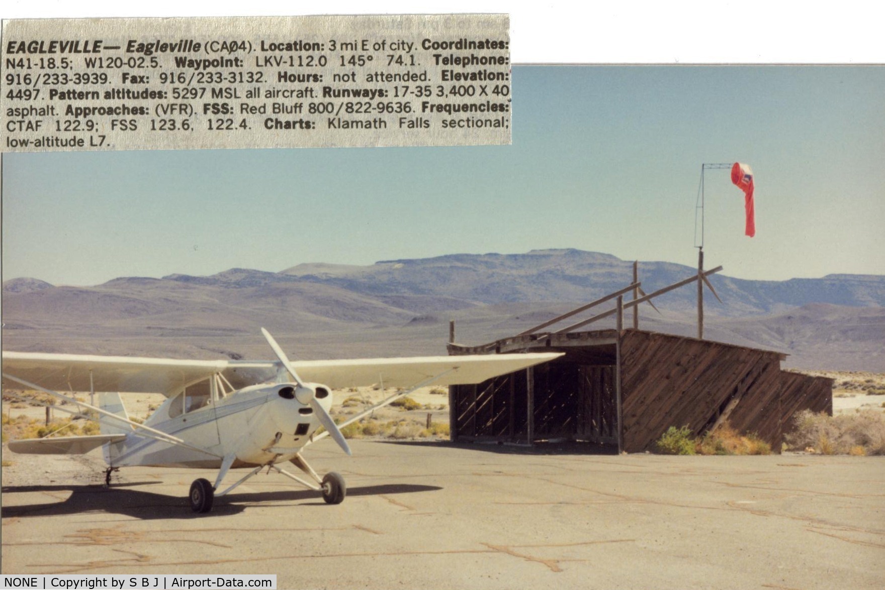 NONE Airport - Eagleville airport which was closed around 2000 was a nice little airport in NE calif.While it was in Ca,the mountains seen are in Nevada.This stop was in 1988. This nice hangar was the only structure at the airport.