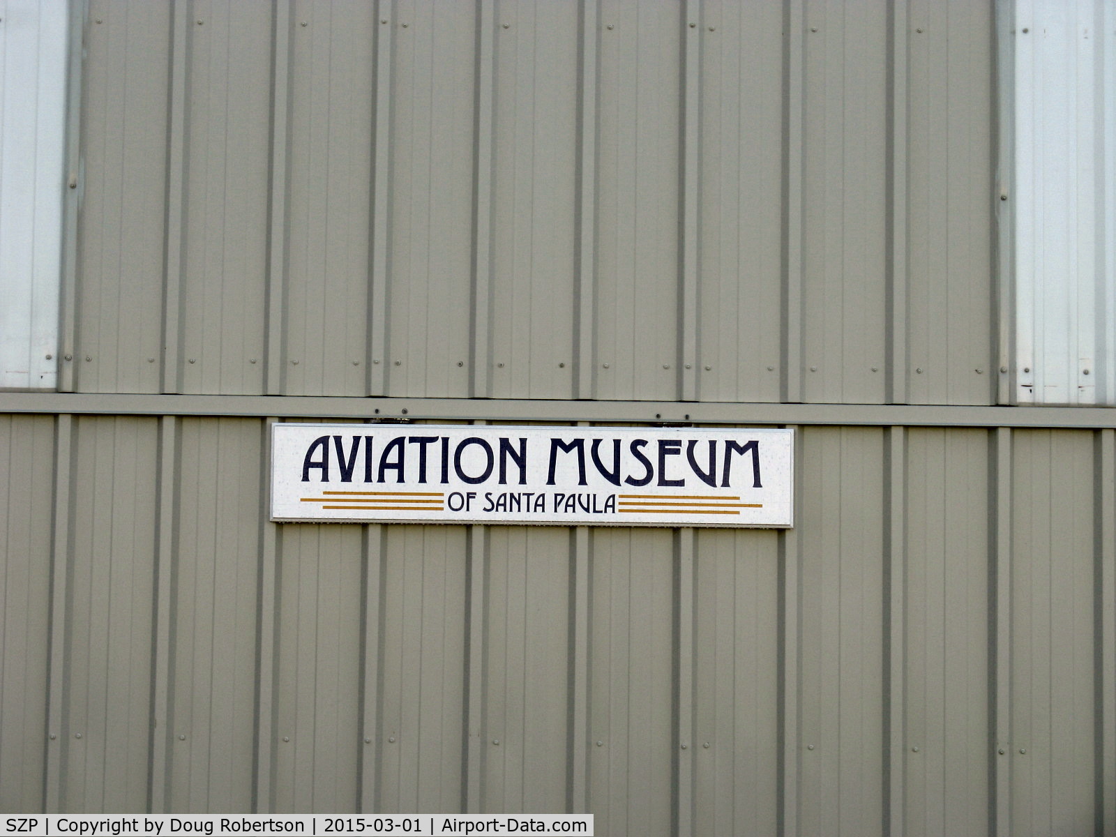 Santa Paula Airport (SZP) - Main Hangar Sign of Aviation Museum of Santa Paula, on closed bi-fold doors.