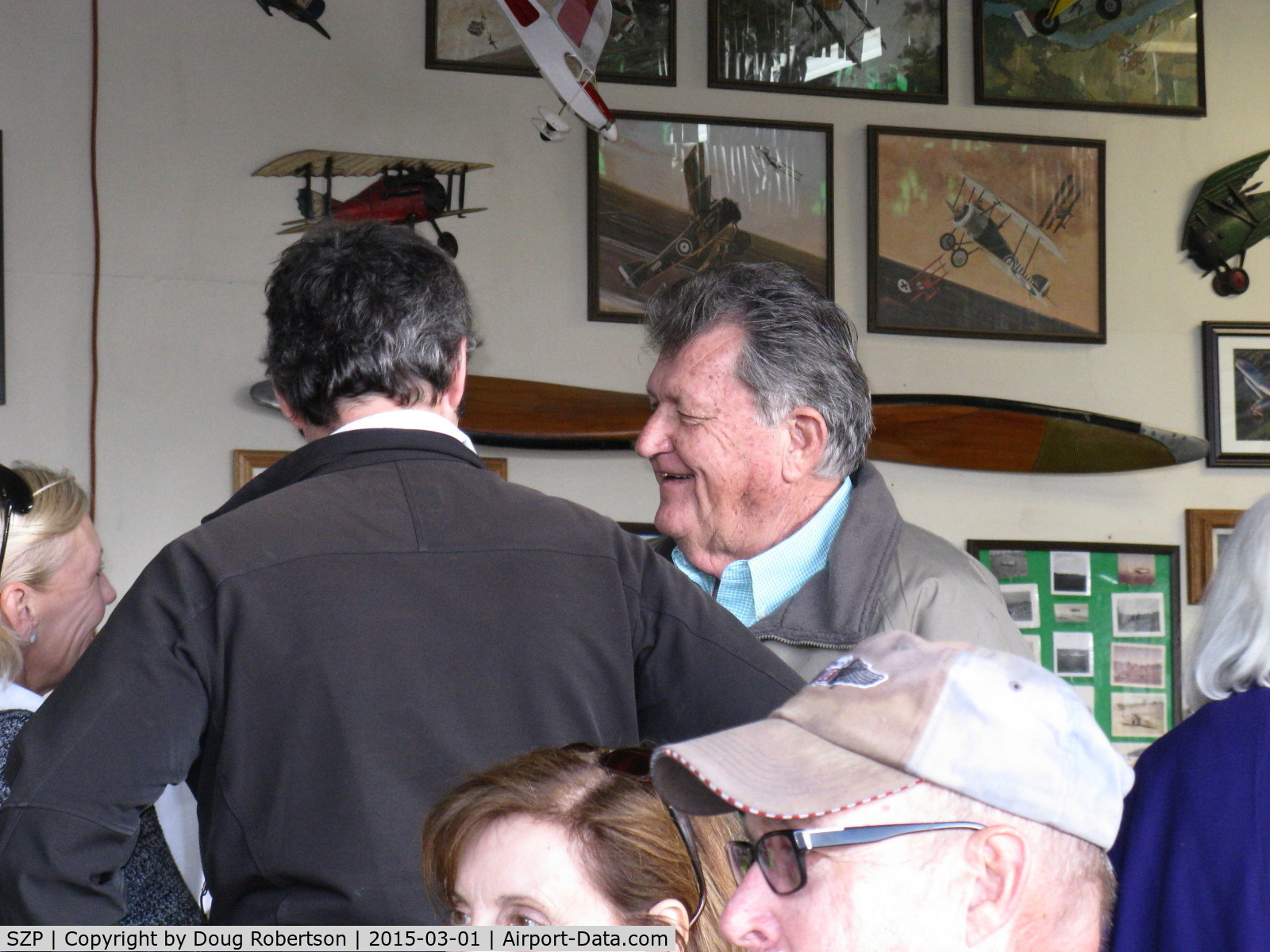Santa Paula Airport (SZP) - Host Pat Quinn in his Bucker Museum Hangar greeting friends before the luncheon celebrating his 50 year flying FAA Wright Brothers Master Pilot Award. Pat has owned an incredible 55 airplanes in that time!!!