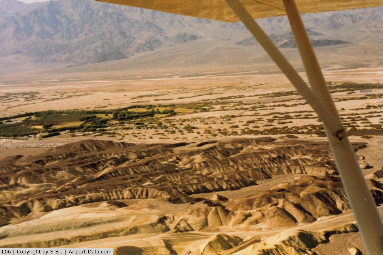 Furnace Creek Airport (L06) - Furnace Creek looking to the SW. Airport is seen at the top of the wing strut.