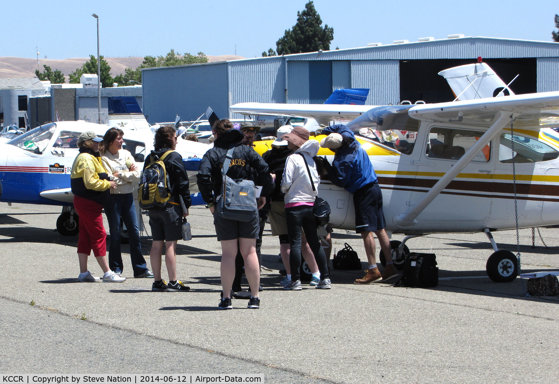 Buchanan Field Airport (CCR) - 2014 Air Race Classic judges, pilots and ground crews checking out a new arrival for the race @ Buchanan Field, Concord, CA