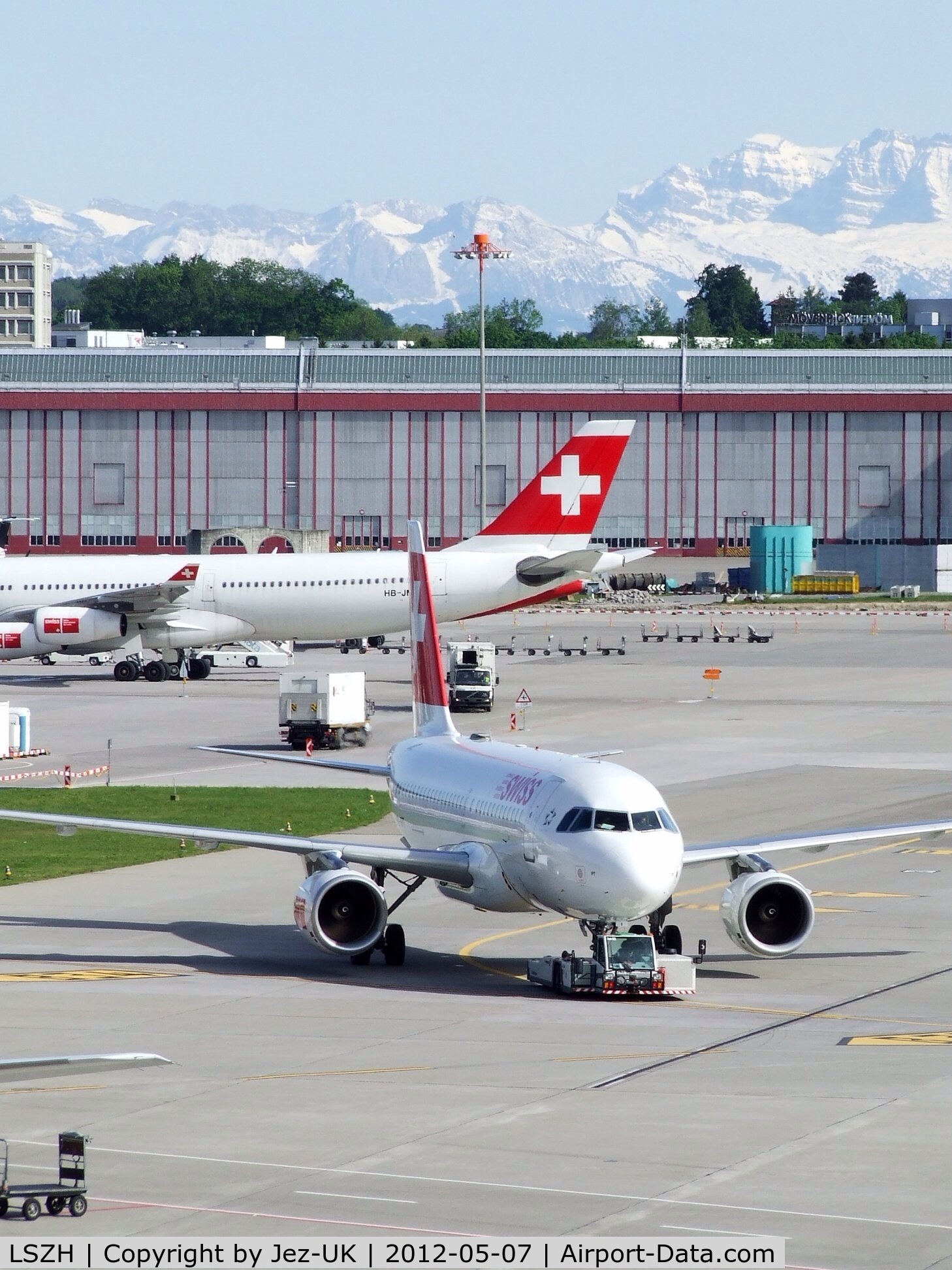 Zurich International Airport, Zurich Switzerland (LSZH) - a view from one of spectator terraces of one of main aprons with the mountains oo the Alps in background,