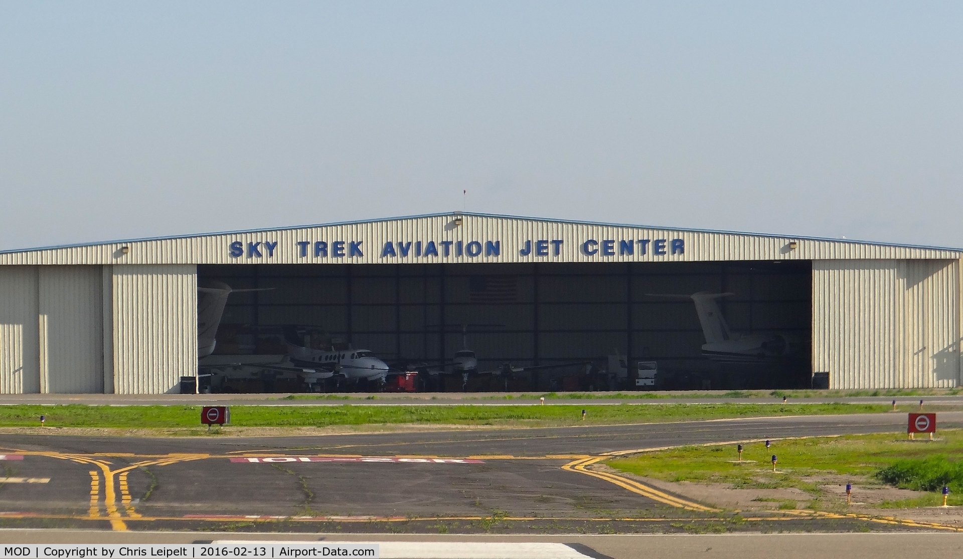 Modesto City-co-harry Sham Fld Airport (MOD) - Sky Trek Aviation hangar at Modesto County Airport, Modesto, CA. Note one of the King Airs in the hangar flew to Reid Hillview for the Super Bowl.