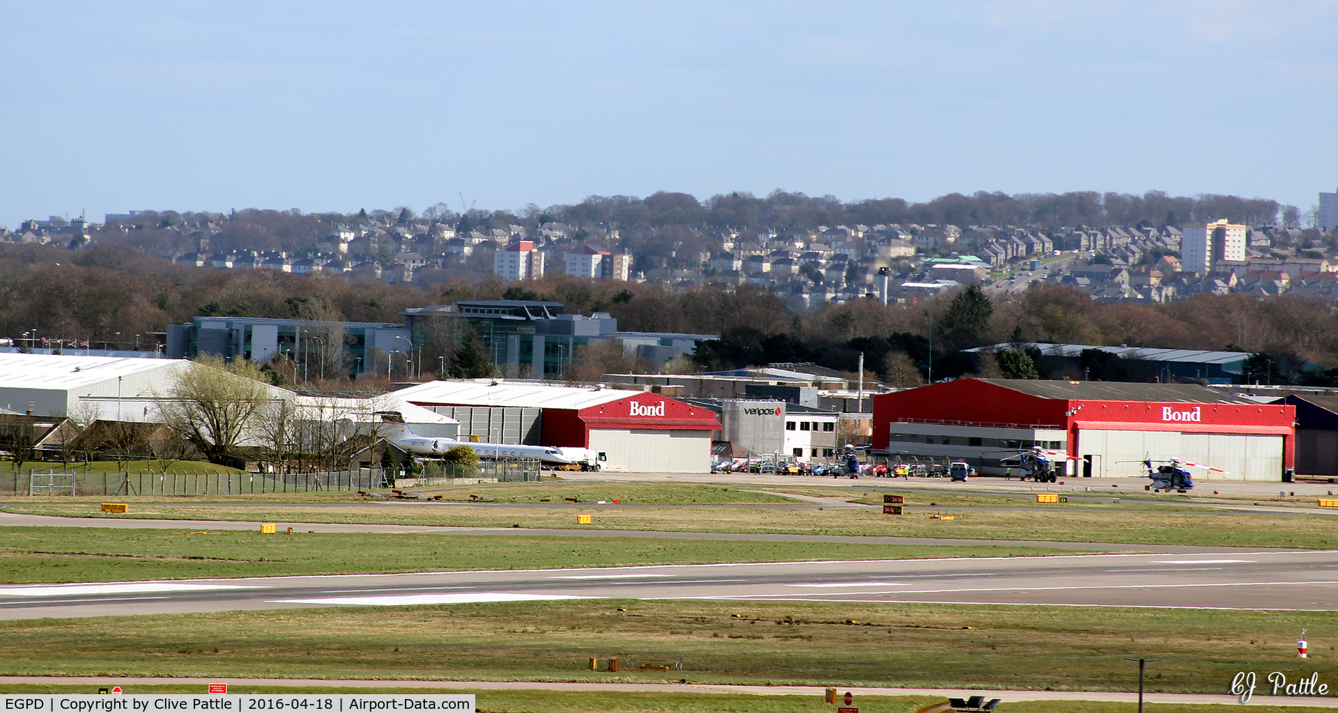 Aberdeen Airport, Aberdeen, Scotland United Kingdom (EGPD) - Bond Helicopters hangars at Aberdeen EGPD - with GA park on left of apron.
