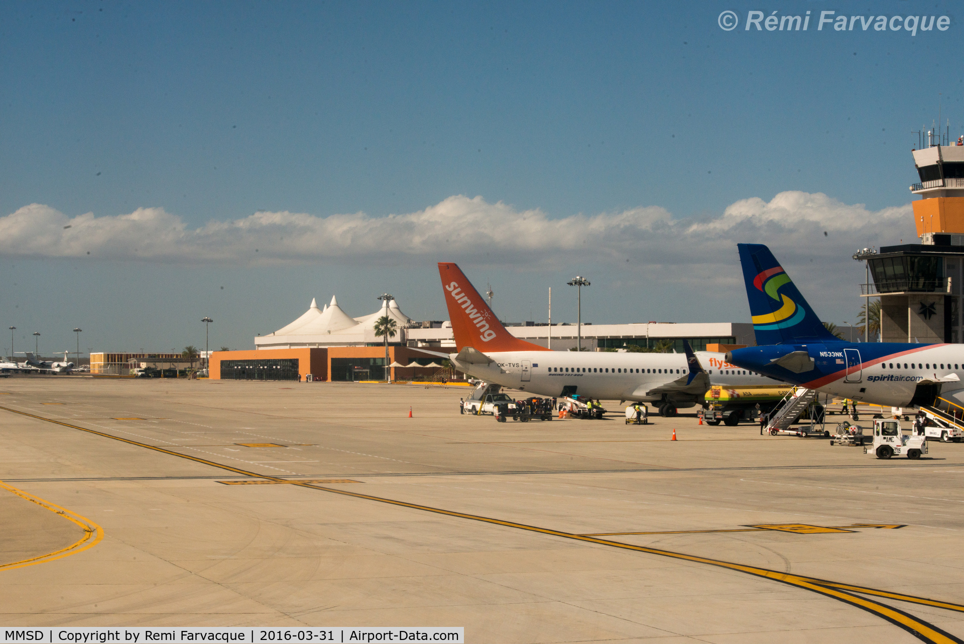 Los Cabos International Airport, Los Cabos, Baja California Sur Mexico (MMSD) - View of main parking area in front of terminal building as taxiing for take-off.