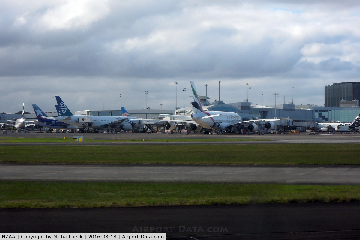 Auckland International Airport, Auckland New Zealand (NZAA) - Busy international terminal: 2 EK A380, LA B788, CZ 788, NZ 772, NZ A320