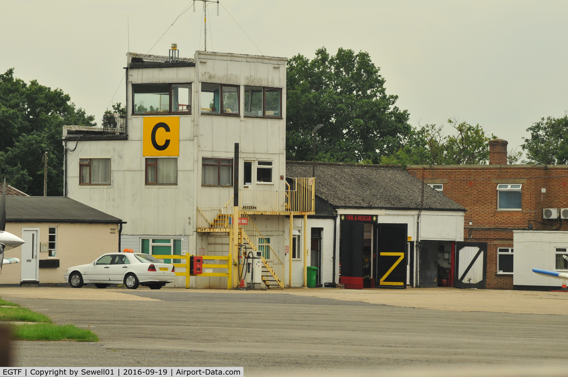 Fairoaks Airport, Chobham, England United Kingdom (EGTF) - CONTROL TOWER
'Follow me' Mercedes in front of the building