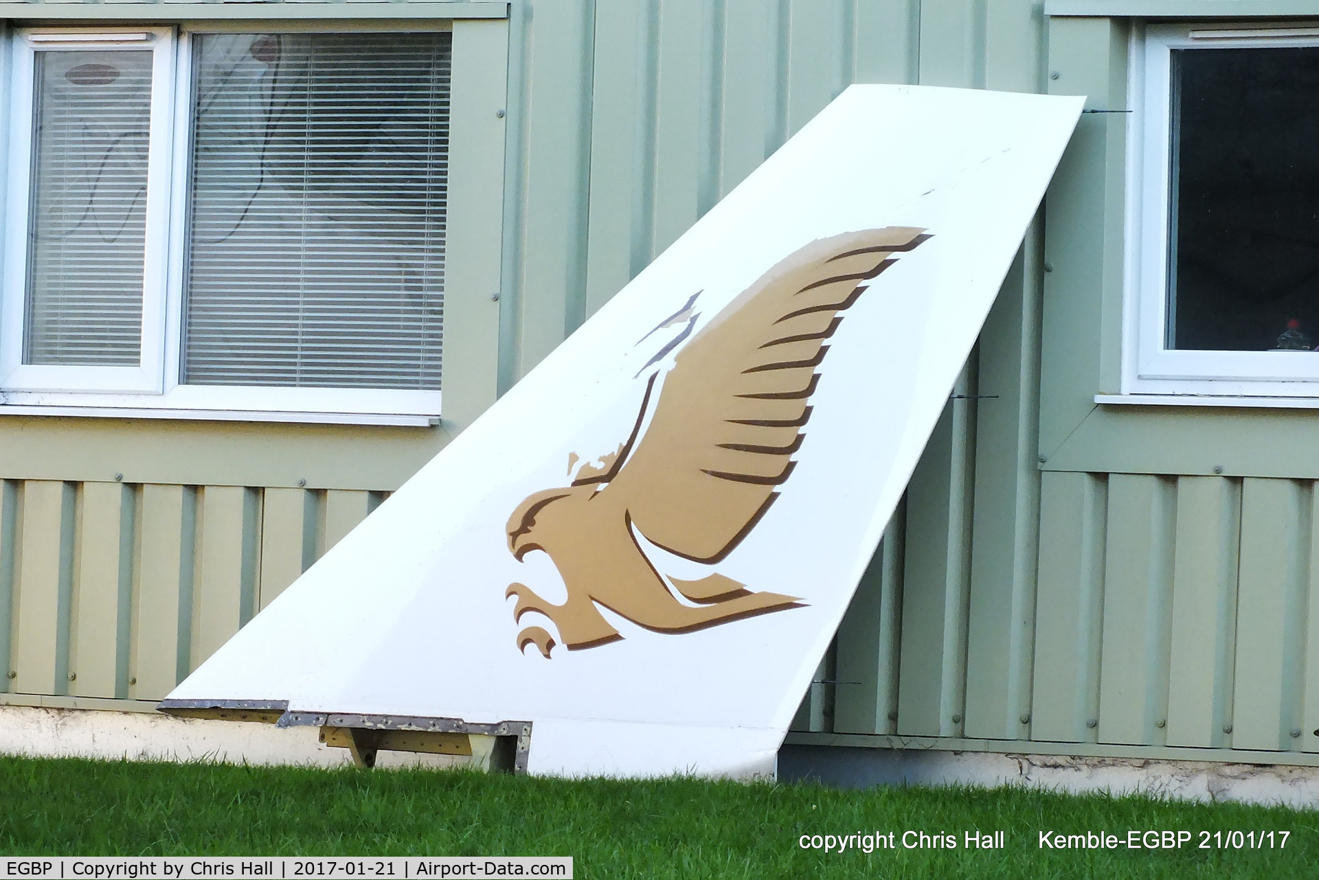 Kemble Airport, Kemble, England United Kingdom (EGBP) - winglet from former Gulf Air A340 next to the ASI hangar at Kemble