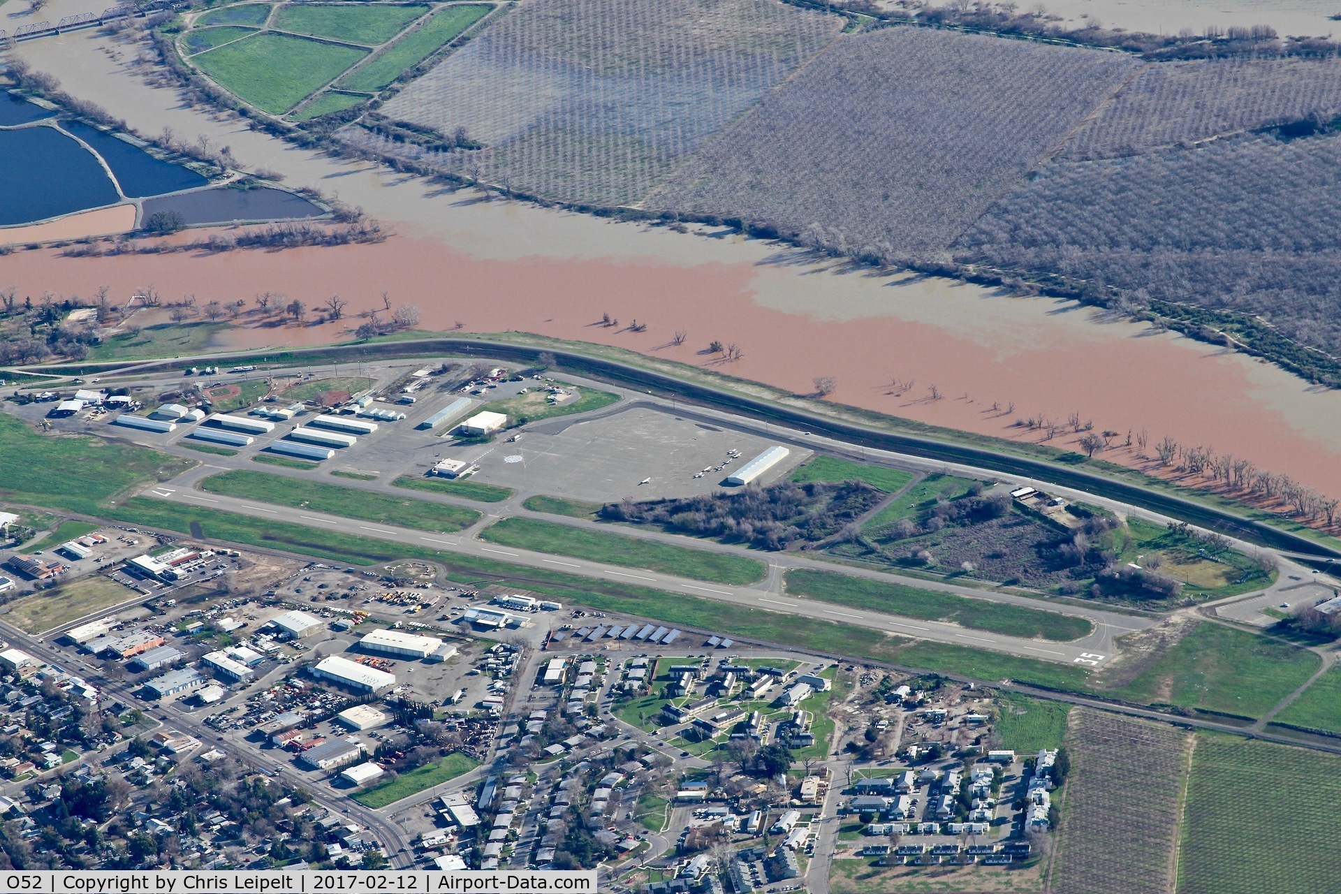 Sutter County Airport (O52) - Overhead Sutter County Airport enroute to Oroville Municipal Airport. Note the fill river abeam the airport. This was taken when Lake Oroville was over capacity and had the dam situation. In fact, mandatory evacuations were made the same day I took this p