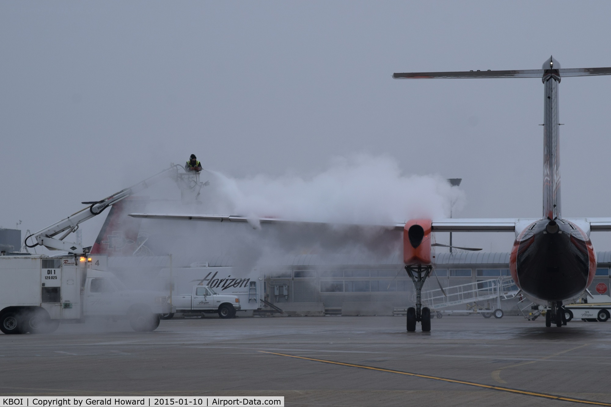 Boise Air Terminal/gowen Fld Airport (BOI) - De ice in progress on the Alaska/Horizon ramp.