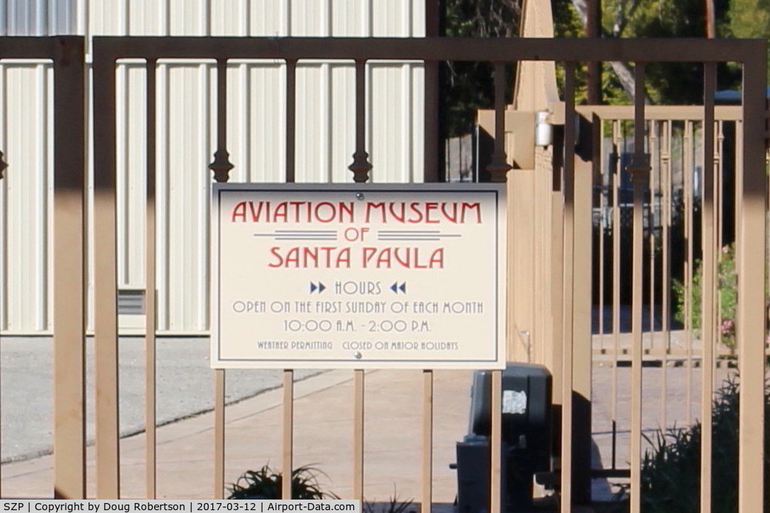 Santa Paula Airport (SZP) - Aviation Museum of Santa Paula-Days, Hours of Open House most First Sundays. This gate at airport entry parking lot otherwise locked.