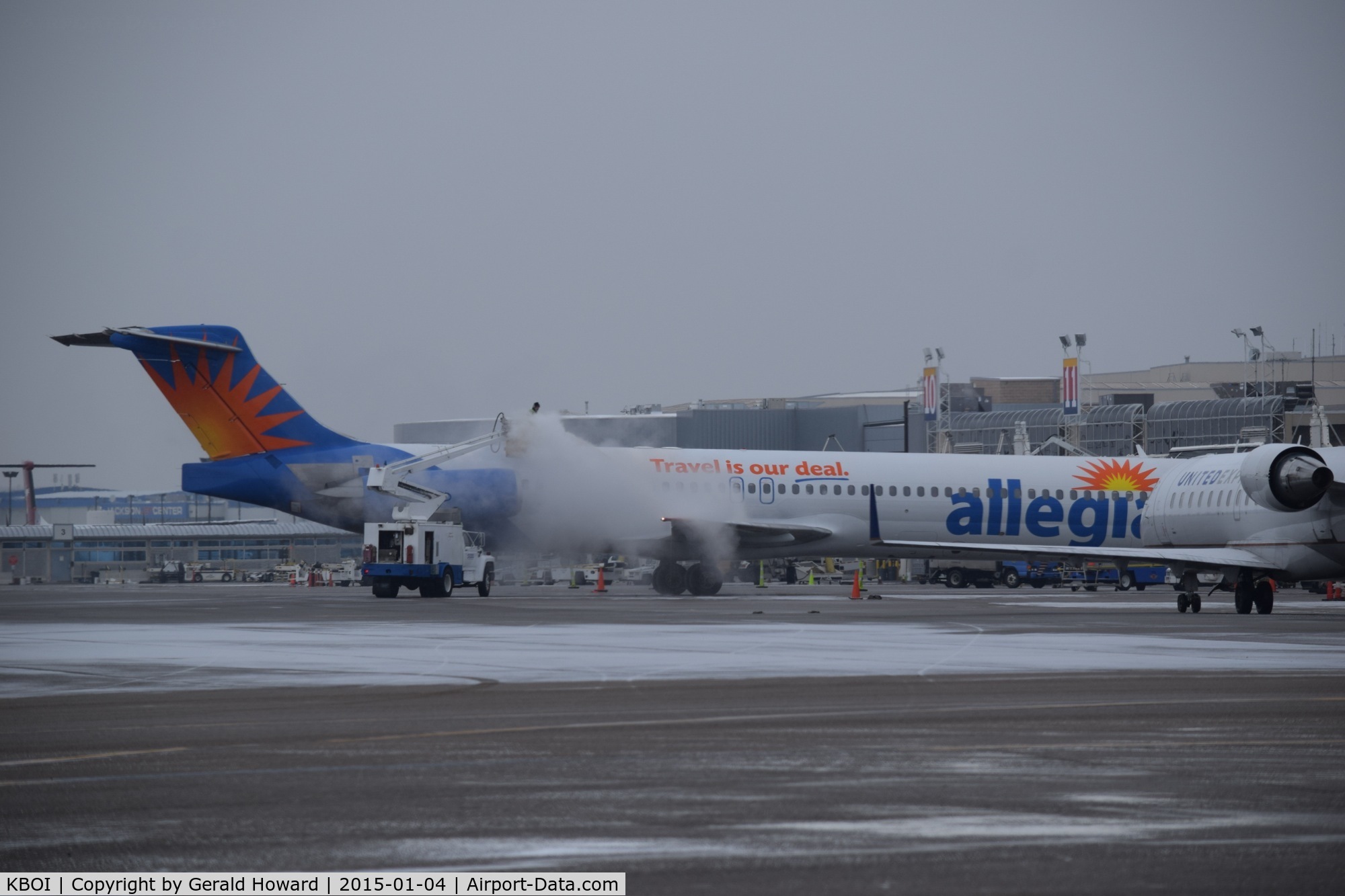 Boise Air Terminal/gowen Fld Airport (BOI) - De ice operations during a cold, snowy morning.